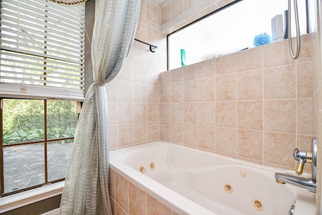 bathroom with a combined bath / shower with jetted tub