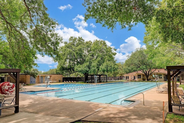 pool featuring a patio and fence