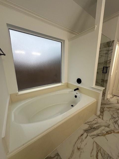 bathroom featuring ornamental molding, marble finish floor, walk in shower, and a bath