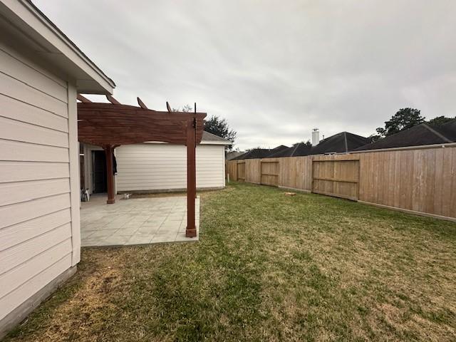 view of yard featuring a patio, fence private yard, and a pergola