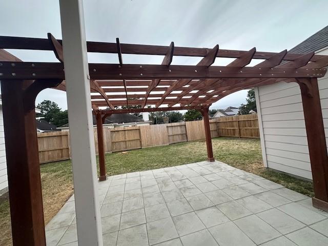 view of patio featuring a fenced backyard and a pergola