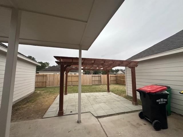 view of patio featuring a fenced backyard and a pergola