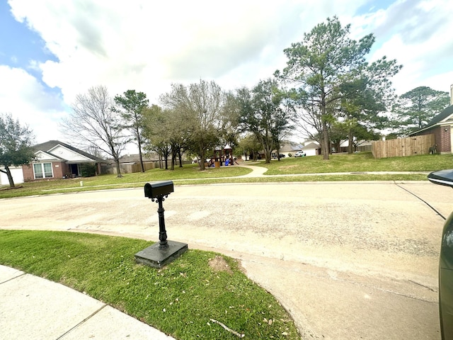 view of street with sidewalks and curbs