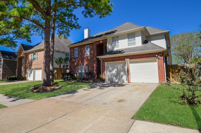 view of front facade featuring an attached garage, brick siding, driveway, a chimney, and a front yard