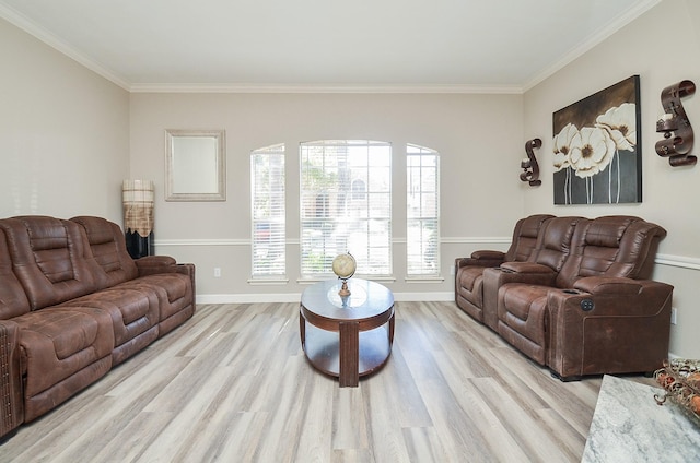 living room featuring baseboards, light wood-type flooring, and crown molding