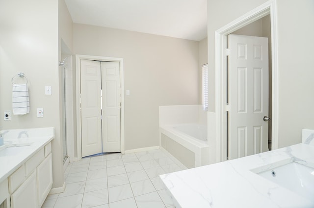 full bath featuring a shower stall, baseboards, a bath, and vanity