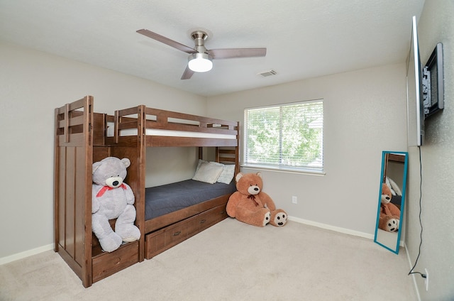 bedroom featuring baseboards, visible vents, and carpet flooring