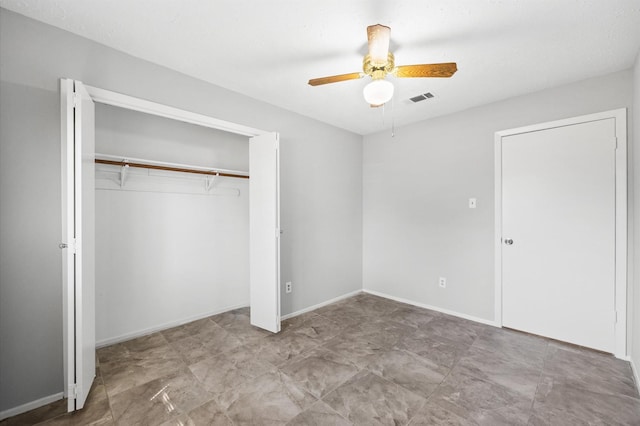 unfurnished bedroom with a ceiling fan, a closet, visible vents, and baseboards