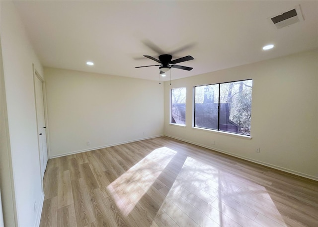 unfurnished room featuring recessed lighting, visible vents, light wood-style flooring, and ceiling fan