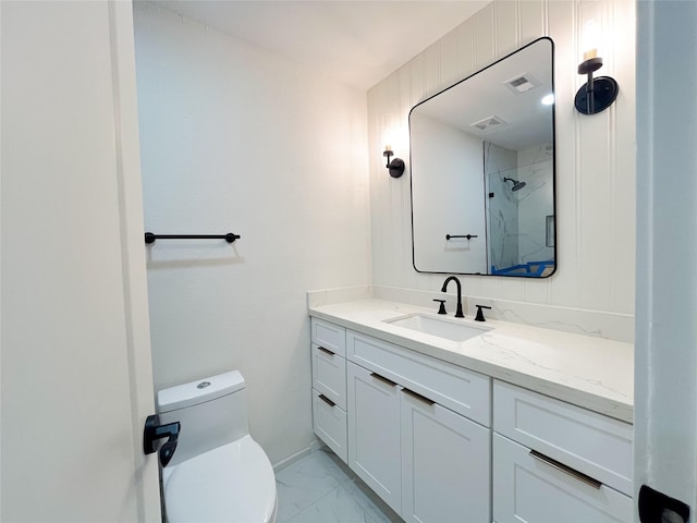 bathroom featuring visible vents, toilet, a stall shower, marble finish floor, and vanity