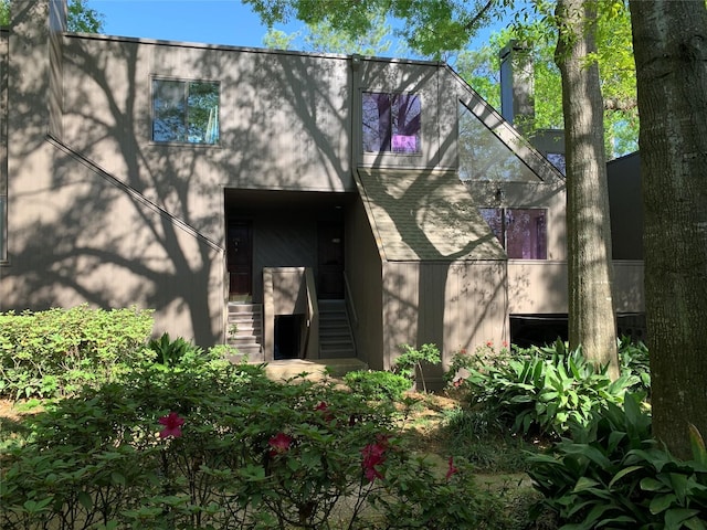 238 Litchfield Ln, Houston, TX 77024 - view of side of home featuring a chimney