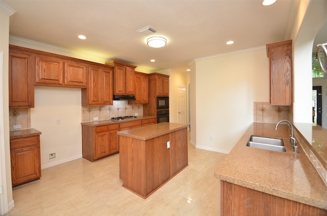 kitchen with black appliances, brown cabinetry, a sink, and a center island