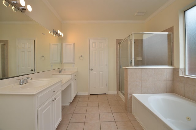 bathroom with double vanity, a stall shower, tile patterned flooring, and a sink