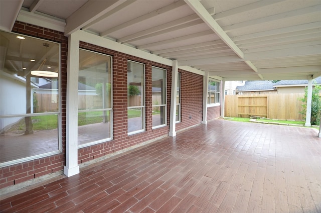 view of patio featuring fence