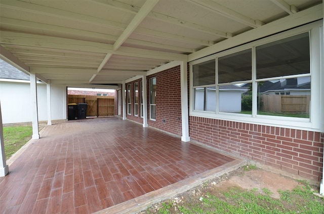 view of patio featuring fence