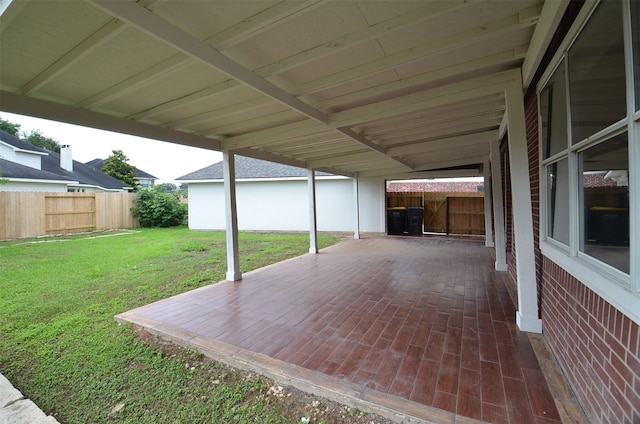 view of patio featuring fence