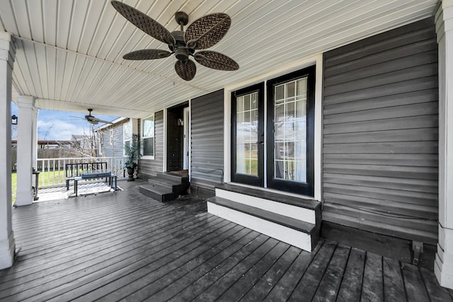 deck with entry steps and ceiling fan