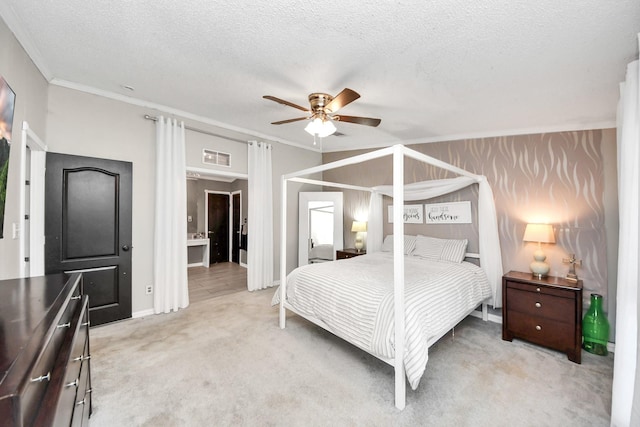 bedroom featuring visible vents, a ceiling fan, light colored carpet, ornamental molding, and a textured ceiling