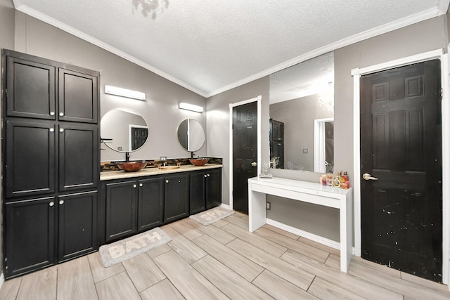 bathroom with double vanity, wood tiled floor, vaulted ceiling, and crown molding