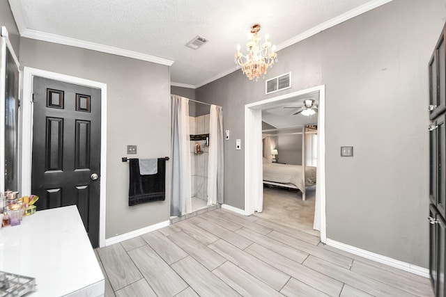 ensuite bathroom featuring ensuite bath, a shower stall, visible vents, and crown molding