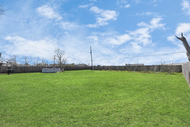 view of yard featuring a fenced backyard