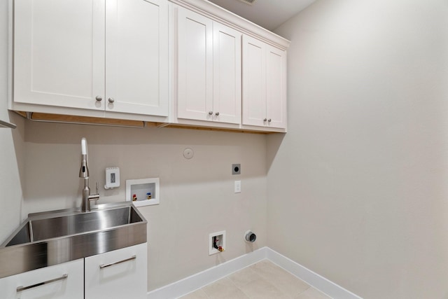 clothes washing area with hookup for a washing machine, gas dryer hookup, cabinet space, a sink, and electric dryer hookup