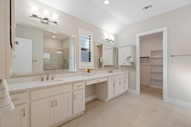 full bathroom featuring a sink, visible vents, a stall shower, and double vanity