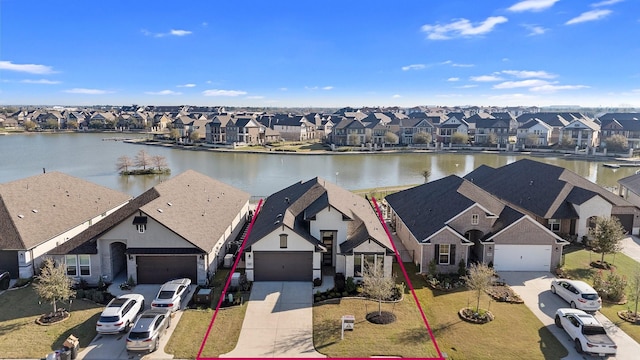 bird's eye view with a residential view and a water view