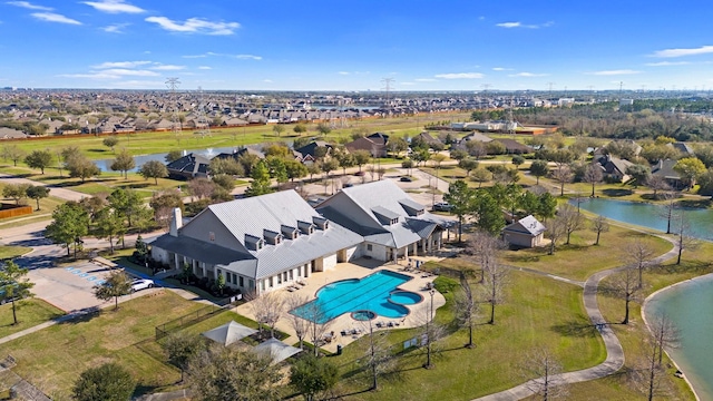 drone / aerial view with a residential view and a water view