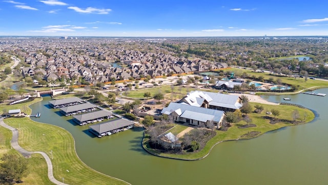 drone / aerial view with a residential view and a water view