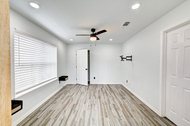 empty room with baseboards, recessed lighting, visible vents, and light wood-style floors