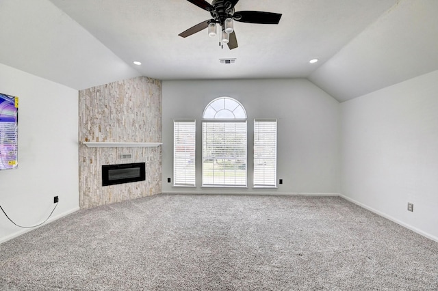 unfurnished living room featuring carpet, a fireplace, baseboards, and vaulted ceiling