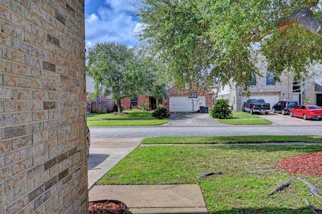 view of yard with concrete driveway