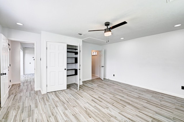 unfurnished bedroom featuring recessed lighting, light wood-type flooring, visible vents, and baseboards