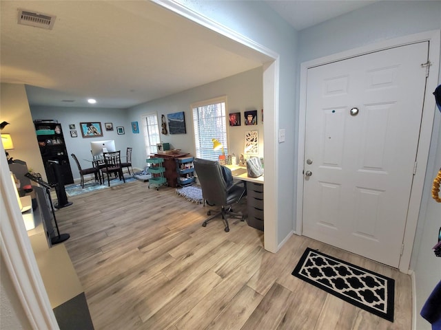 foyer featuring visible vents and light wood finished floors