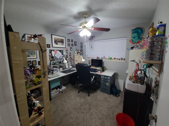 carpeted office featuring ceiling fan and a textured ceiling