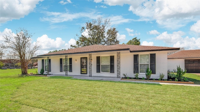 ranch-style house with brick siding, a porch, and a front yard