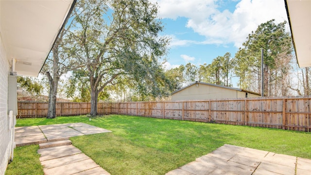 view of yard featuring a patio area and a fenced backyard