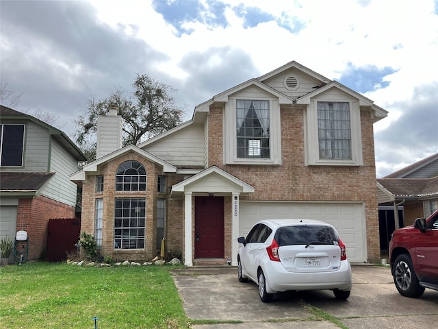 traditional-style house featuring brick siding, a chimney, concrete driveway, an attached garage, and a front lawn