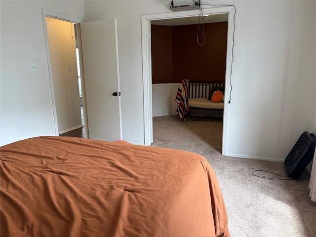 carpeted bedroom featuring baseboards