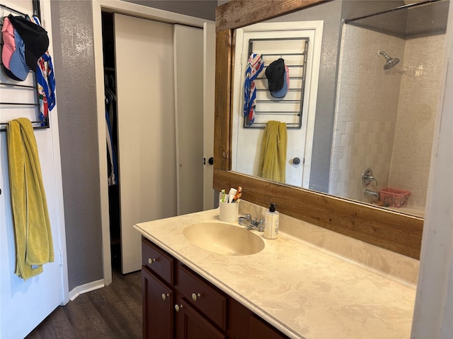 bathroom featuring wood finished floors and vanity