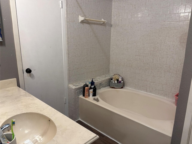 full bathroom with vanity and a bathtub