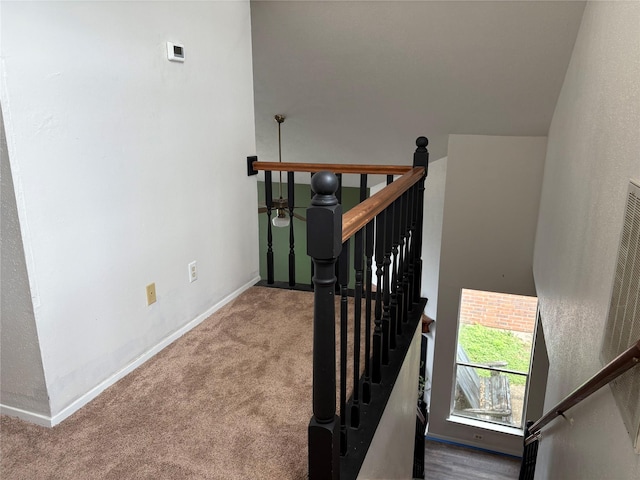 stairs with carpet flooring and baseboards