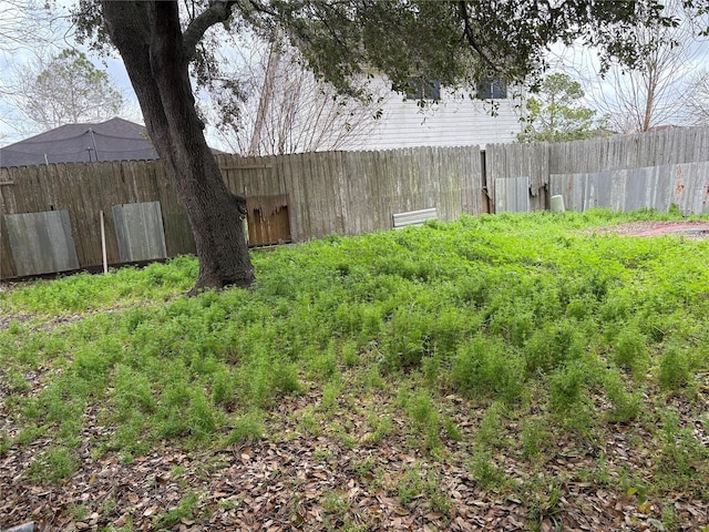 view of yard with fence