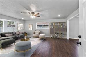 living room featuring ceiling fan, recessed lighting, wood finished floors, and baseboards