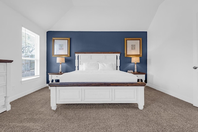 bedroom featuring light carpet, baseboards, and vaulted ceiling