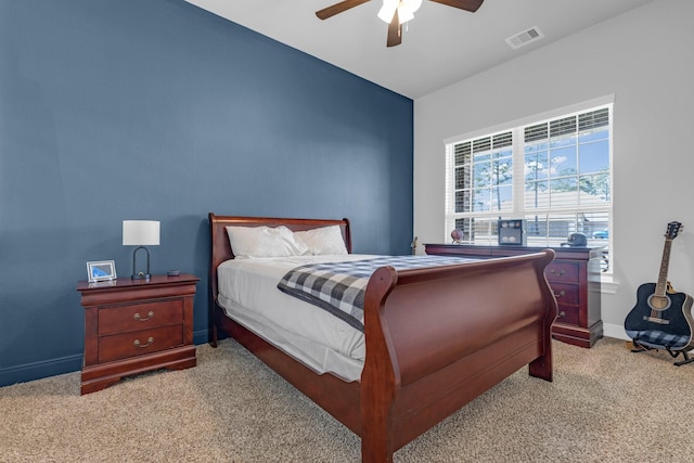 bedroom with visible vents, ceiling fan, light carpet, and baseboards