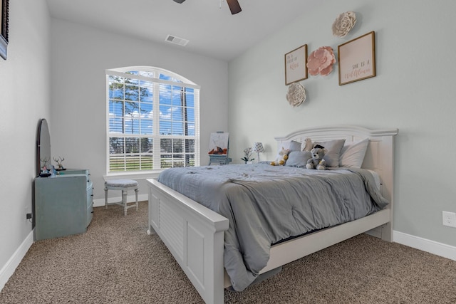 bedroom featuring light carpet, ceiling fan, visible vents, and baseboards