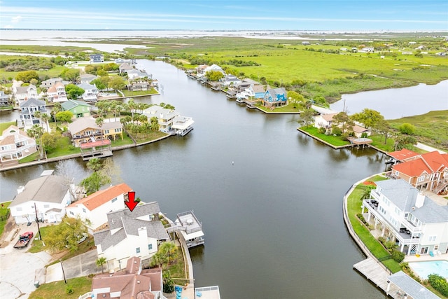 aerial view featuring a residential view and a water view