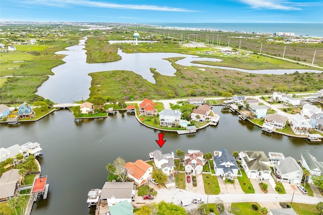 bird's eye view with a residential view and a water view